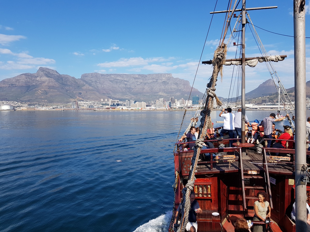 The Jolly Roger pirate ship with Table Mountain in the background - one of the things to do in Cape Town with kids.