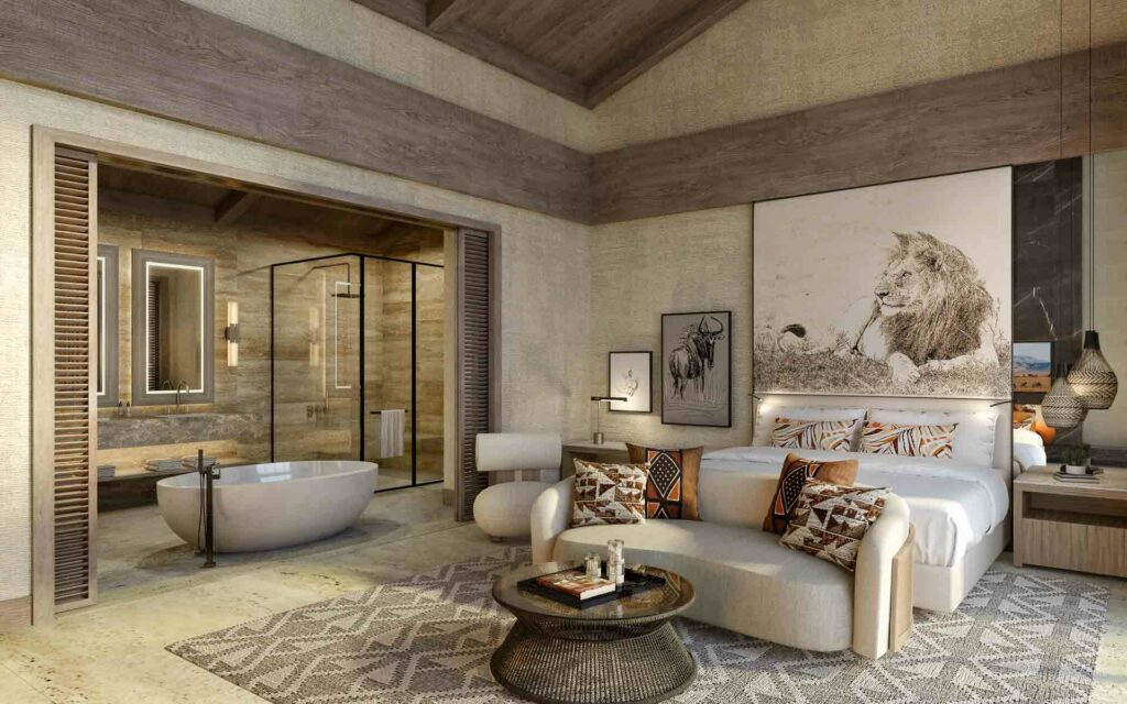 A bedroom and ensuite bathroom at Meliá Ngorongoro Lodge - one of the new African luxury resorts opening in 2023.