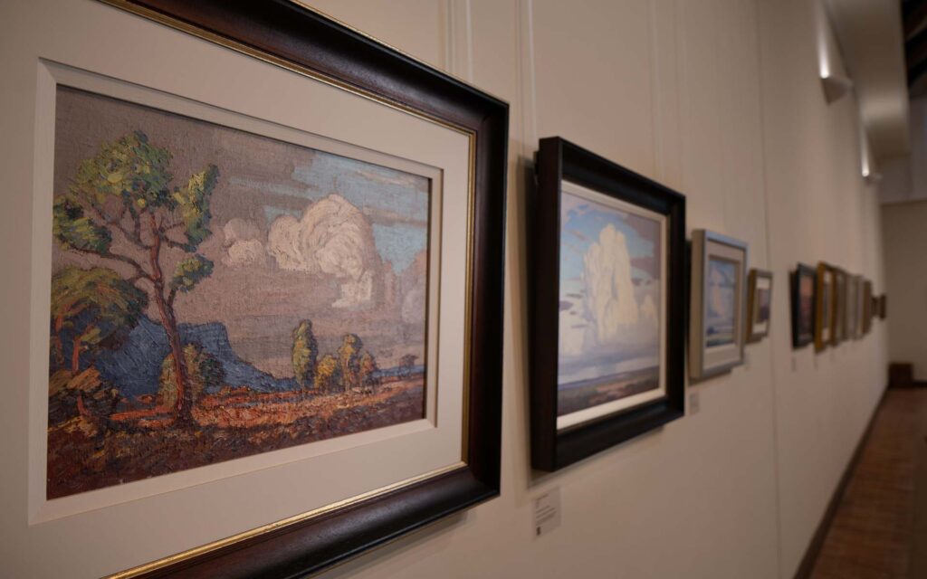 Artworks displayed on the wall by Jacob Hendrik Pierneef at La Motte Museum – one of the top art galleries in Cape Town.
