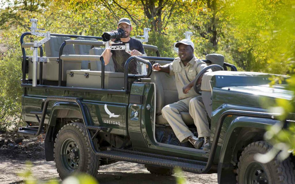 A man taking photos out on safari with &Beyond Ngala Safari Lodge - the ideal destination for a photo safari in Africa.