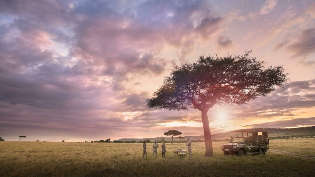 andBeyond Bateleur Camp in Kenya as the sun is setting while having sundowners