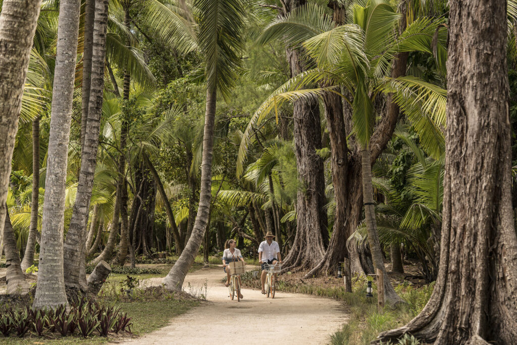 Couple cycling on Seychells Island